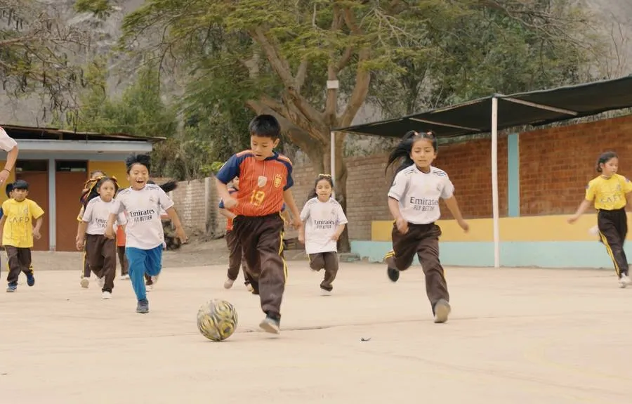 Children playing football in the schoolyard