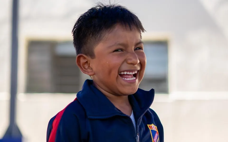 A smiling pupil at school in Cañete